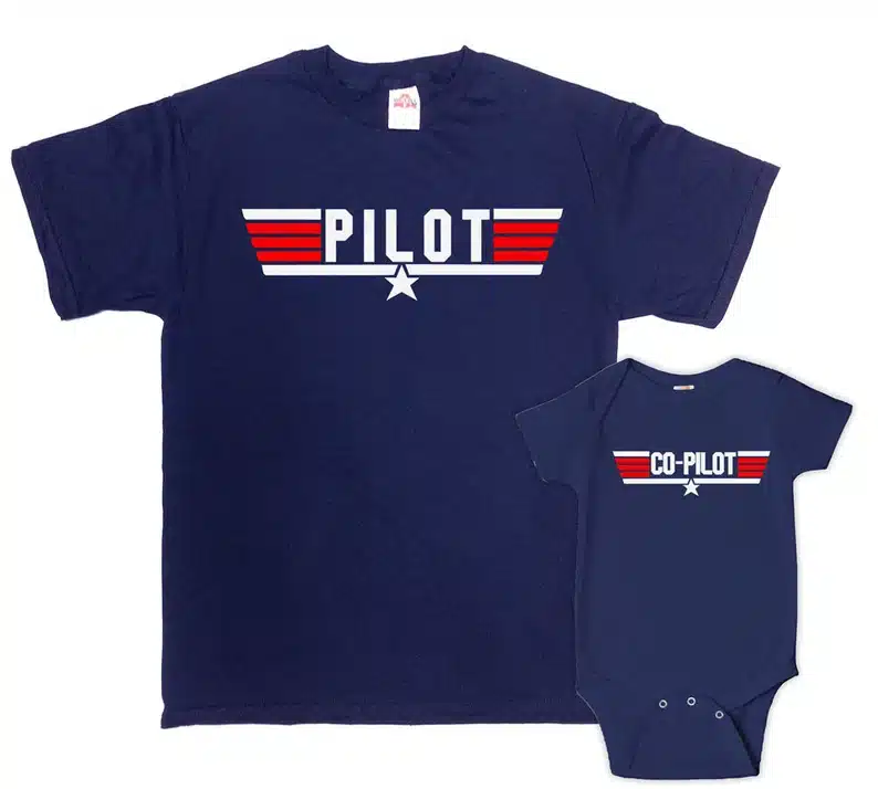 Matching navy blue t-shirt and onesie that says Piolet on the big one and co-pilot on the onesie. 