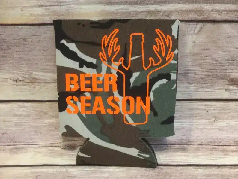 Camo coz with orange text that says Beer season with a beer with antlers. 