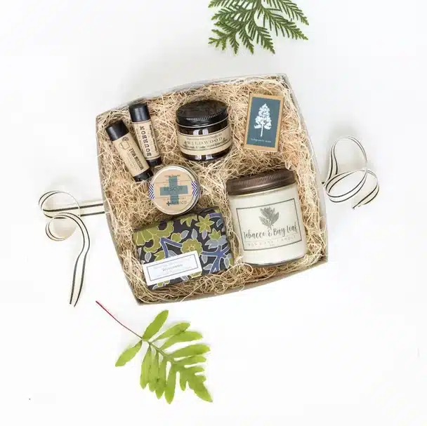 Above view of a luxury gift set for dad, with candle, lap balm, beard stuff and more. 