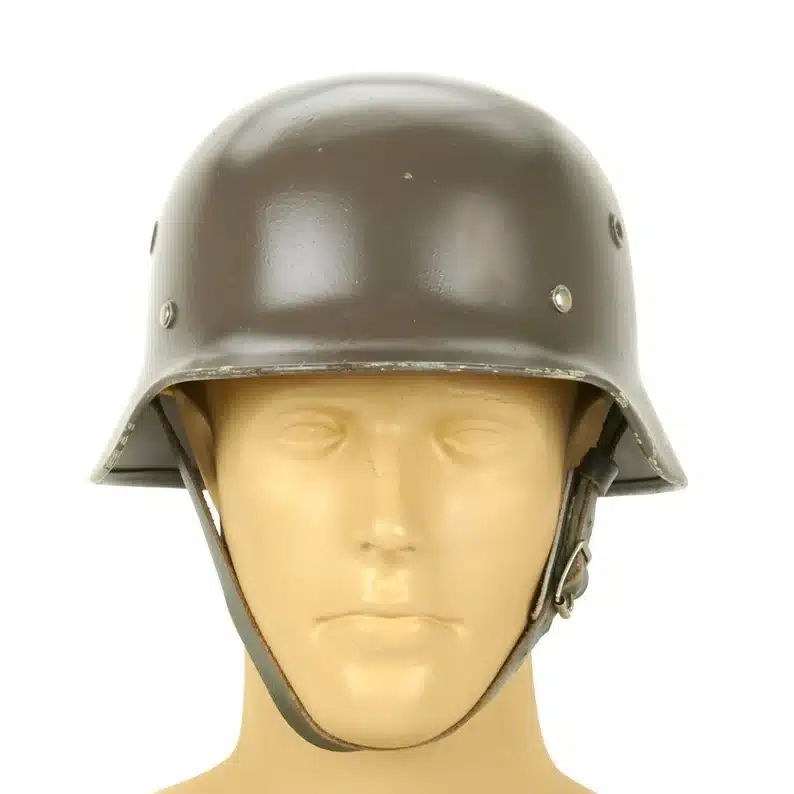 Father’s Day Gifts for History Buffs - Vintage surplus army helmet on a mannequin head. 