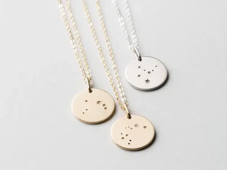 Gift Ideas for a Gemini Woman - three round necklaces with gemini stars on them 