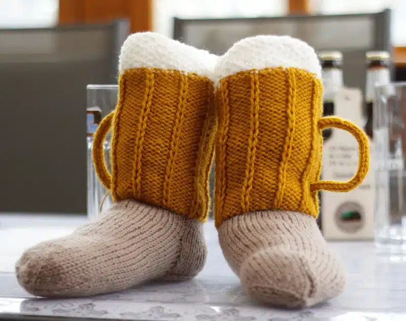 Handmade knit beer socks, socks made to look like beer. 