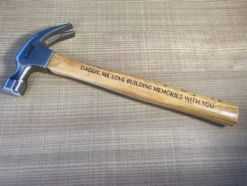 Custom hammer with a saying on the handle. 