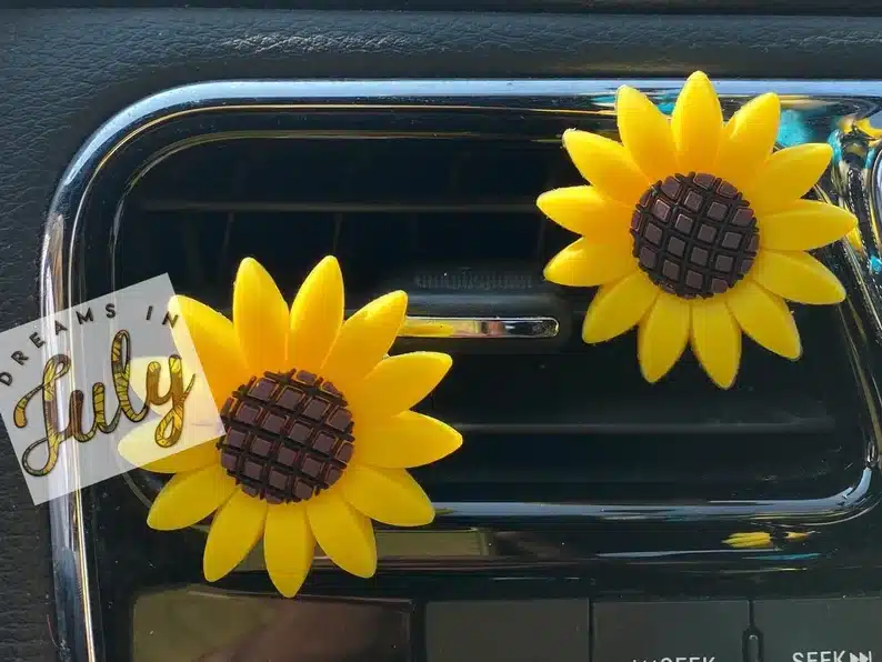Two sunflower car air fresheners.