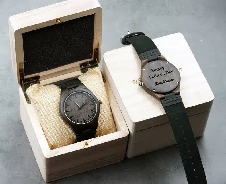 Wooden box with a wooden engraved watch in it. 