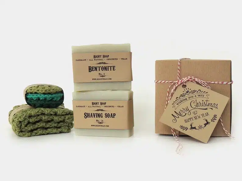Soap gift set for men , two white soap bars and green scrubbers. 