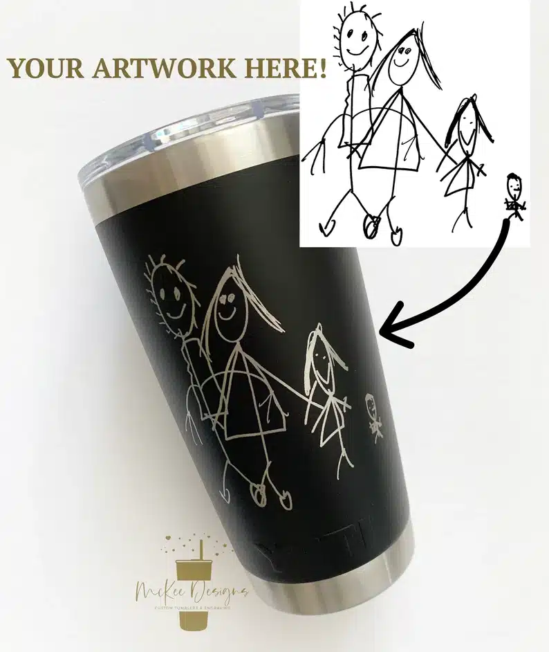 Black tumbler with a custom drawing a kid did on it. 