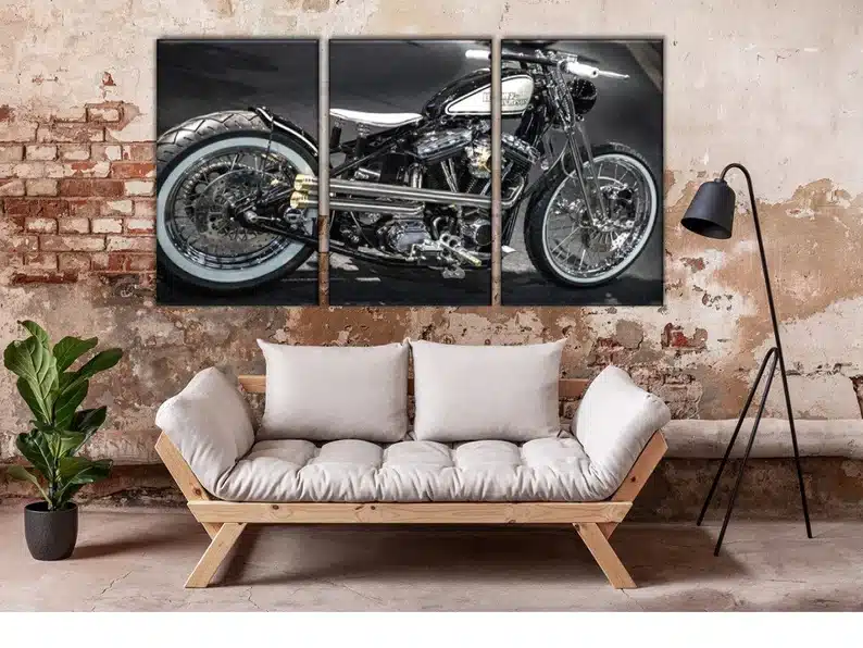 Three separate canvas when put together are a Harley motorcycle. 