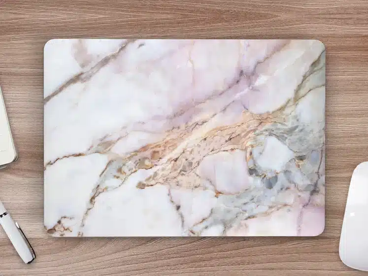 white and grey marble laptop skin cutting board. 
