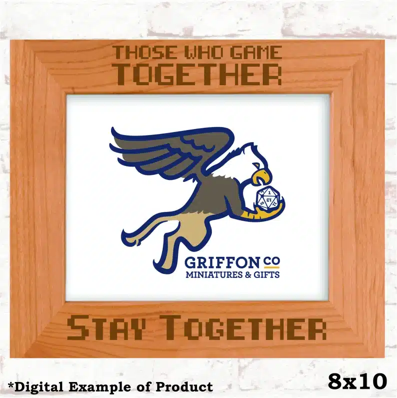 Wooden frame that says Those who game together stay together. With a Griffon in it. 