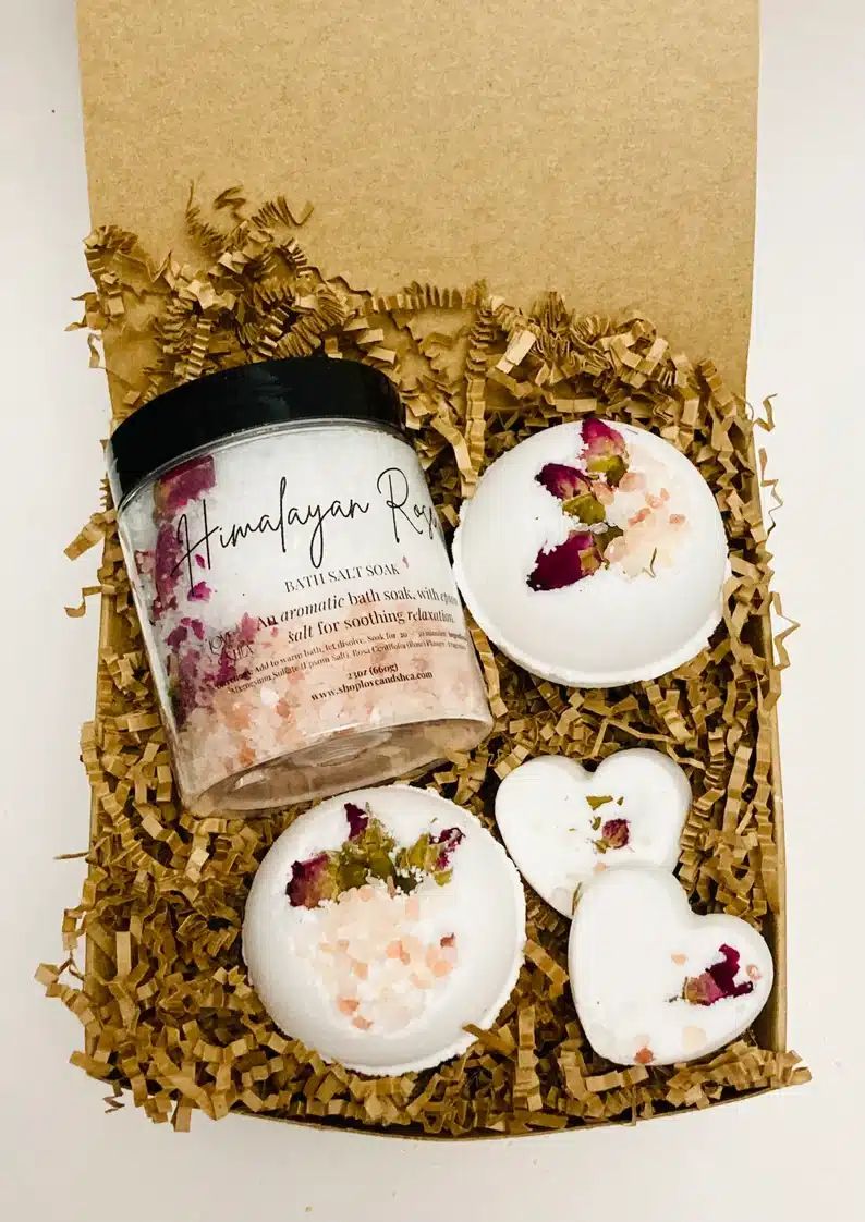 Gift Ideas For a Large Group - Box with rose spa gifts in it, bath bomb, salts, and more. 
