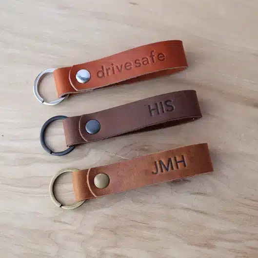 Quick And Easy Father's Day Gifts - three personalized leather keychains all shades of brown. 