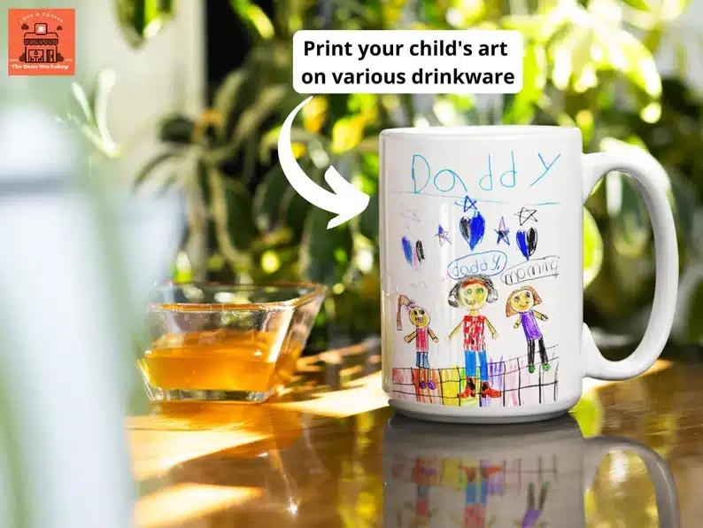Print your child's art on various drinkware, white coffee mug shown with a Childs artwork on it. 