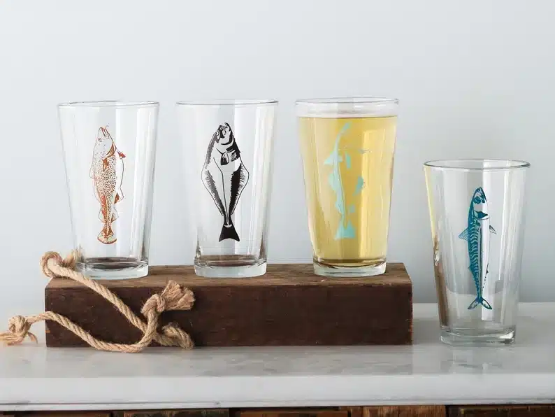 Father's Day Gifts for a Fisherman - Four pint glasses shown, all with different fish on it. 