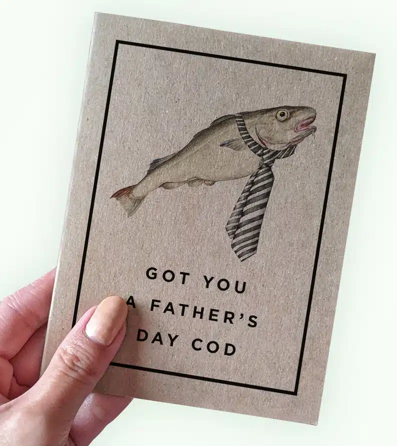 Fish with a tie greeting card that says Got you a father's day cod. 