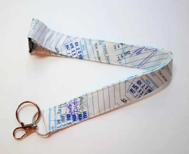 Lanyard with library checkout cards on it. 