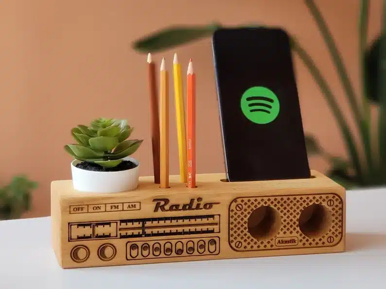 Wooden radio phone holder, wooden block made to look like an old radio that can hold a small plant, pencils, and your phone. 