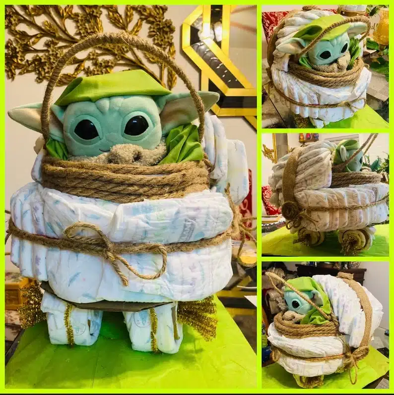 Diaper cake with baby yoda plush sticking out of it. 