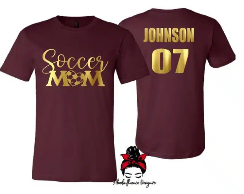 Gifts For a Soccer Mom - dark purple t-shirt with gold font that says soccer mom on the front and the childs last name and number on the back. 
