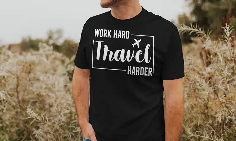 Father’s Day Gifts for Traveling Dads - Black t-shirt with white font that says Word hard travel harder. 