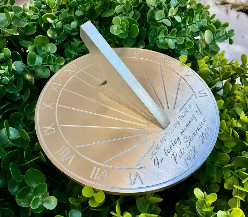 Engraved sundial gold in color. 