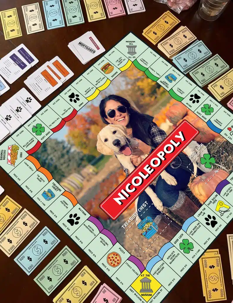 Father’s Day Gifts For a Dad Who Has Everything - Monopoly game with a photo of a woman holding her dog. 