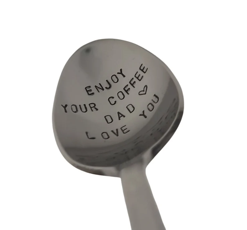 Silver spoon engraved to say "Enjoy your coffee dad, love you. 