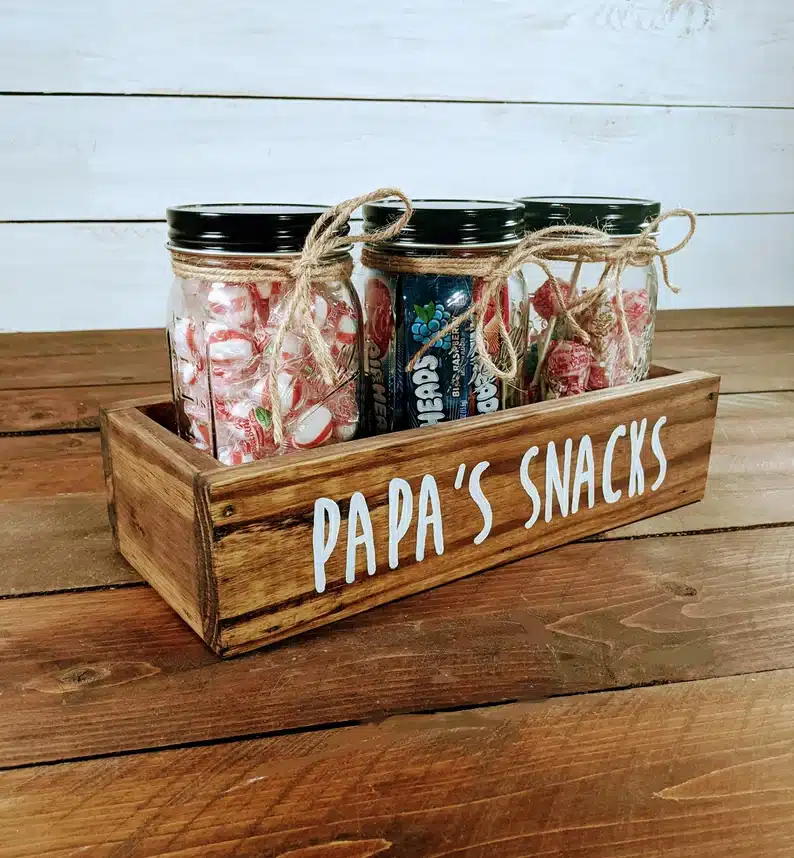 Father’s Day Gifts For Papa - Wooden box that says Papa's Snacks with three jars filled with candy on it. 