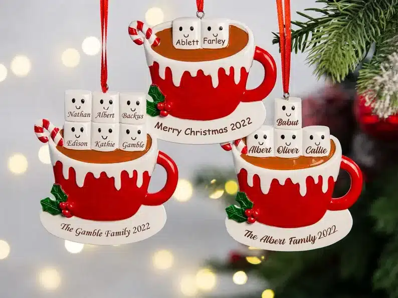 Three personalized Christmas ornaments, all red cups with marshmallows with family members names on it, 6 family set, four, and two. 