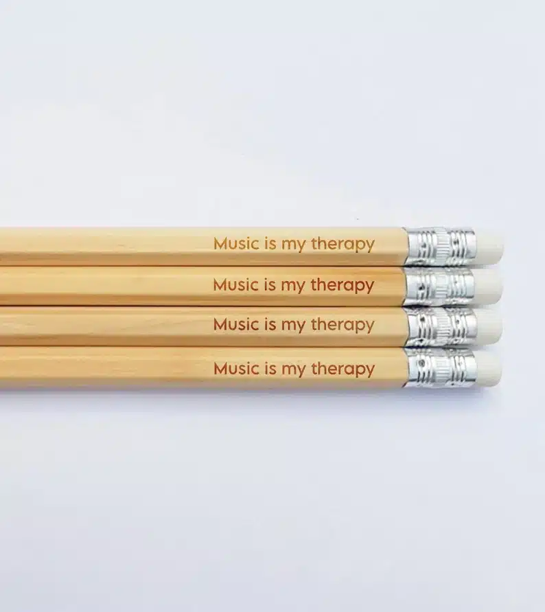 Four pencils that say Music is my therapy 
