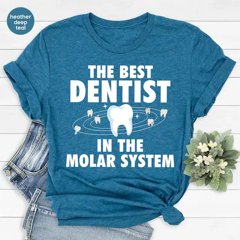 Gifts for Dental Receptionists - Blue t-shirt with white font that says The best dentist in the molar system. 