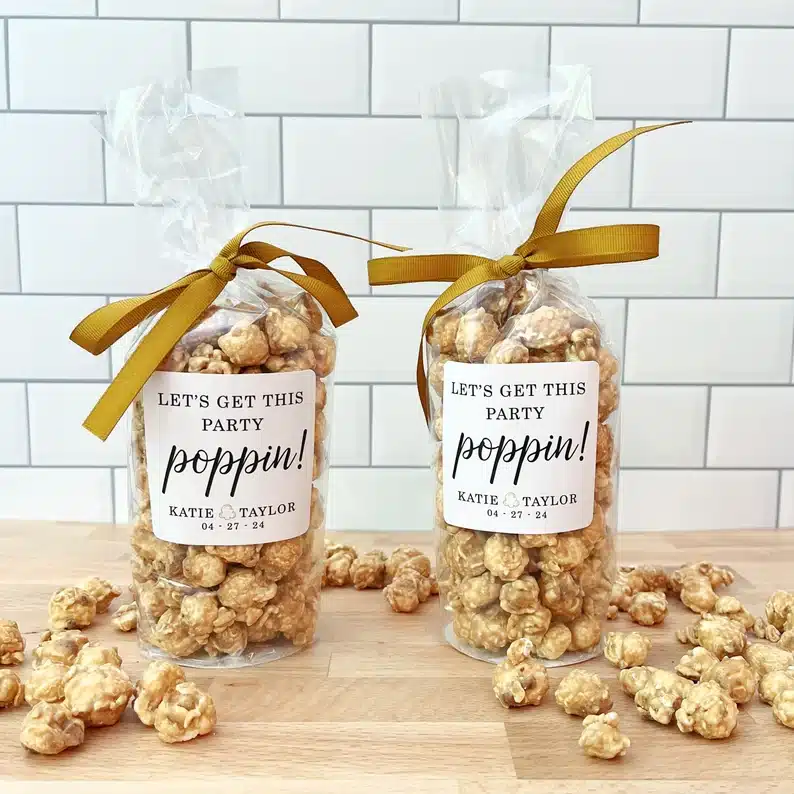 Two clear bags full of caramel popcorn. 