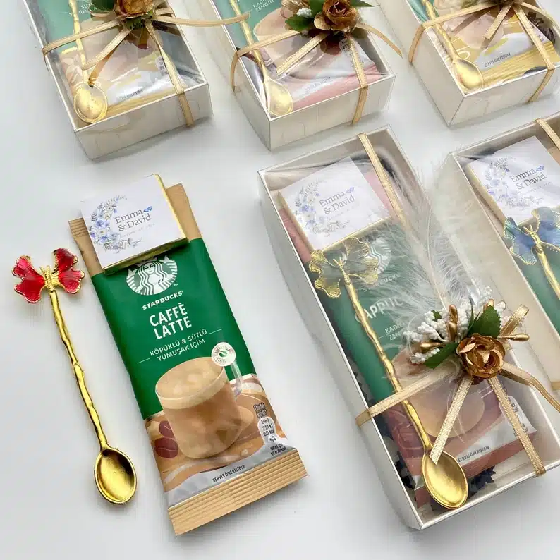 The Most Delicious Edible Wedding Favors - Starbucks coffee packages with a golden spoon and apiece of chocolate with it. 