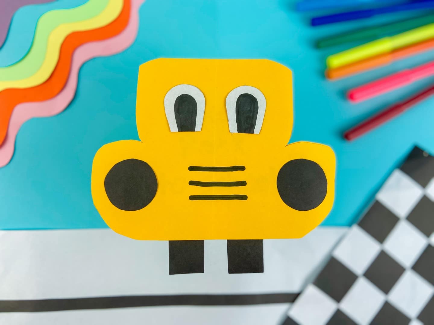 Back to School Fun: DIY School Bus Card Craft Tutorial - Yellow card school bus with eyes and headlights. 