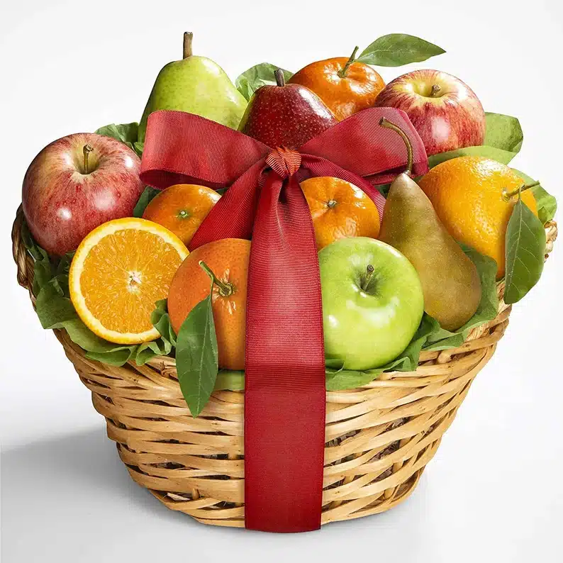 Welcome Gifts for Vacation Rental Guests - Basket filled with fresh fruit and a big red bow. 