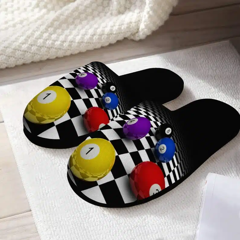 pool themed slippers that are black with colored balls on it. 