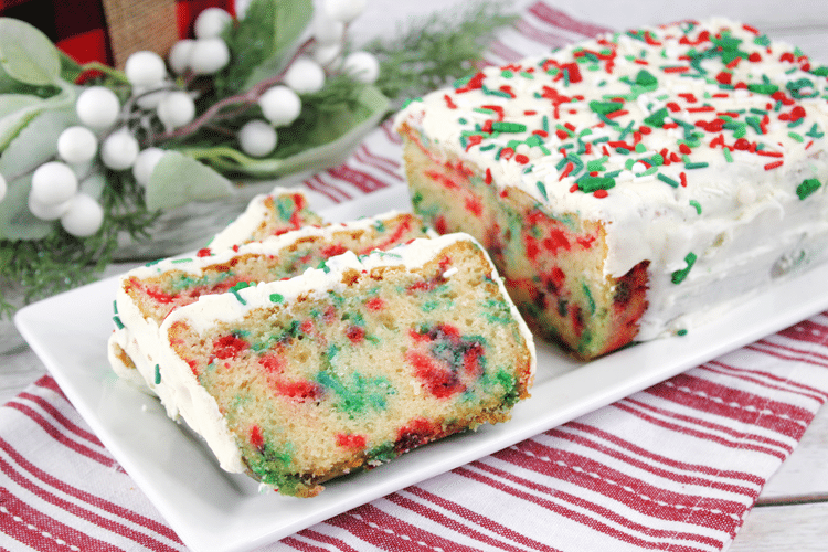 Multi-Color Christmas Bread Loaf - sliced up on a white plate