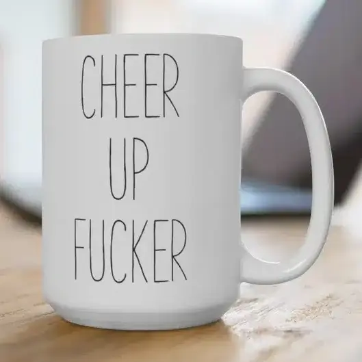 Gifts to Cheer Up Your Boyfriend - white coffee mug that says cheer up fucker on it in black print. 