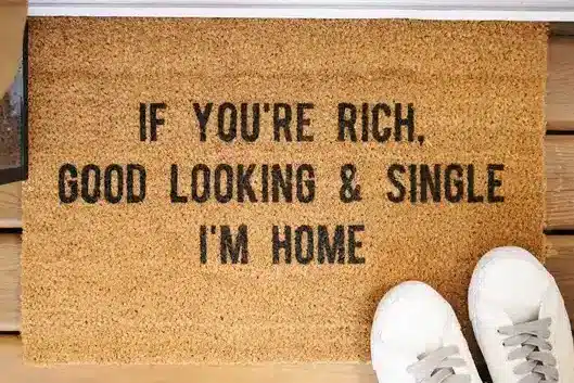 Housewarming Gifts for a Newly Divorced Friend - brown door mat that says If you're rich, good looking, single I'm home. 