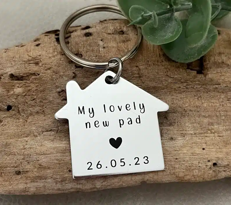 Housewarming Gifts for a Newly Divorced Friend - silver keychain shaped like a house. 