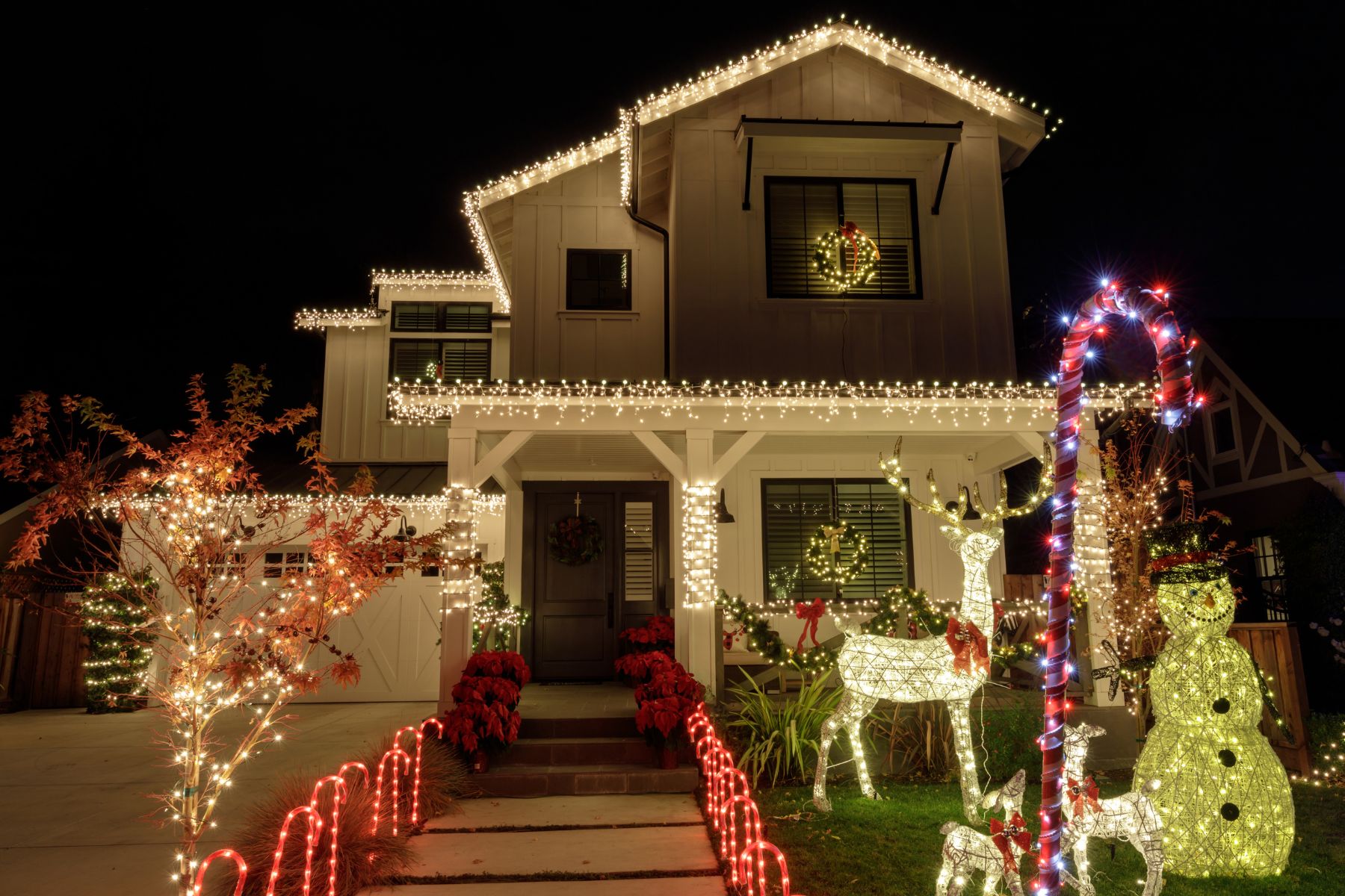 Christmas lights in front of a house
