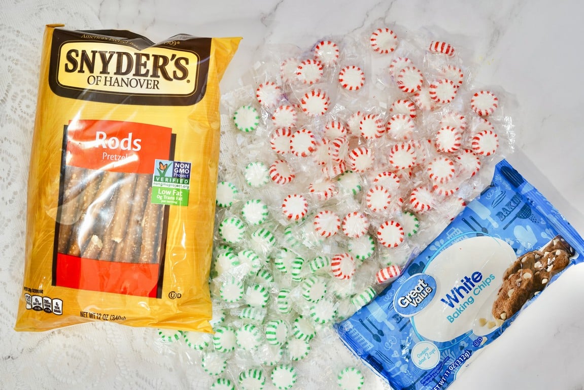 Ingredients needed - bag of pretzel rods, two bags of peppermint candies - one green and white and the other red and white, and a bag of white chocolate baking chips.