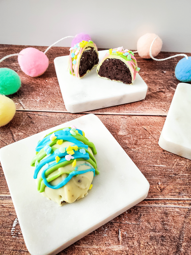 Easter Egg Oreo Truffles - white covered cake with blue and green icing.