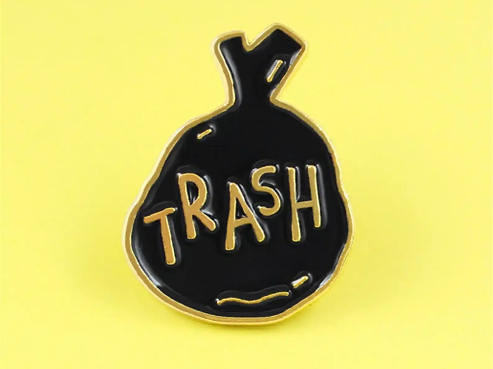 Black trash bag enamel pin