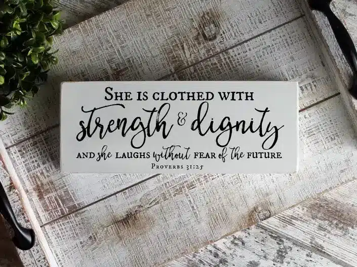 “She is clothed in strength and dignity Proverbs 31:25” Sign