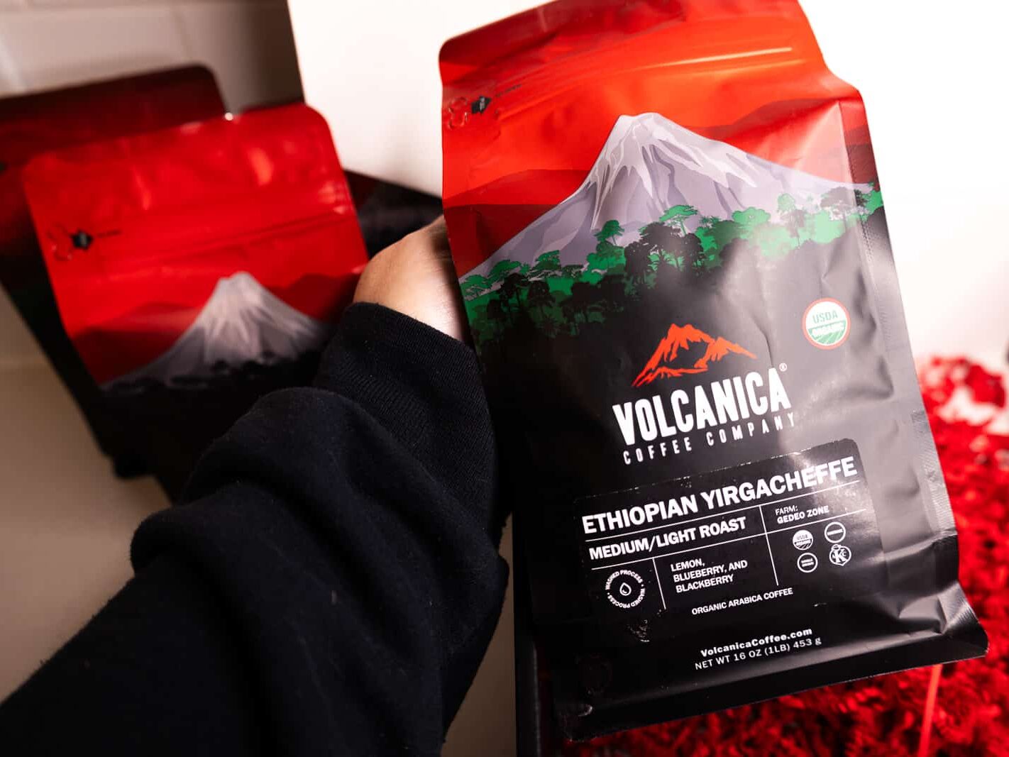 Holding Volcanica brand coffee from the gift box