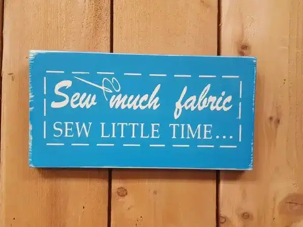 Sew Much Fabric Sew Little Time distressed wooden sign
