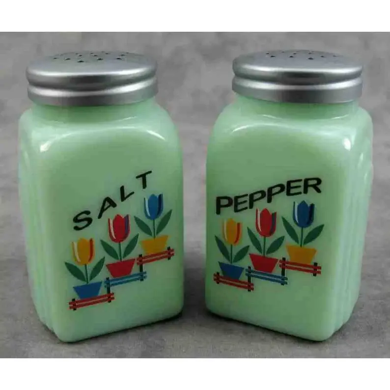 Vintage jade salt and pepper shakes with flowers on them